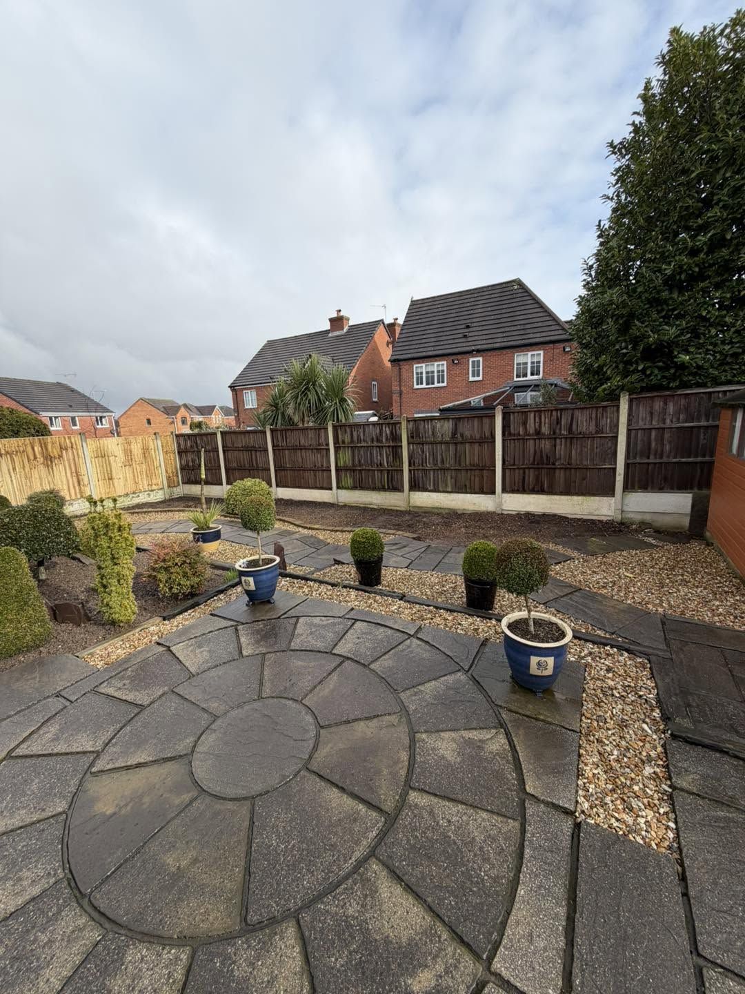 The same circular patio clean after pressure washing