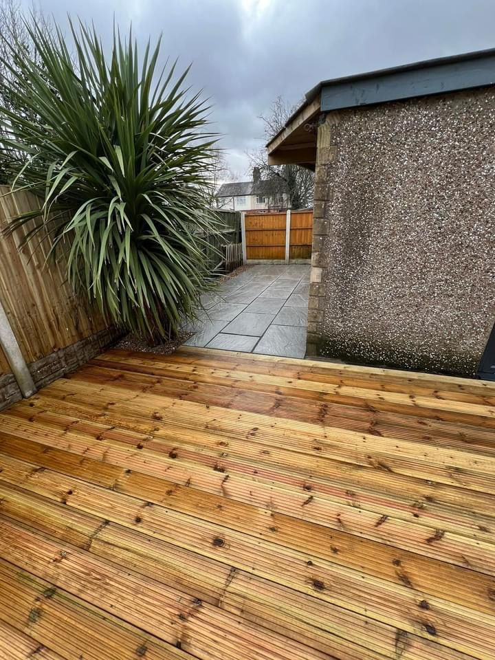 New timber decking with a patio beyond